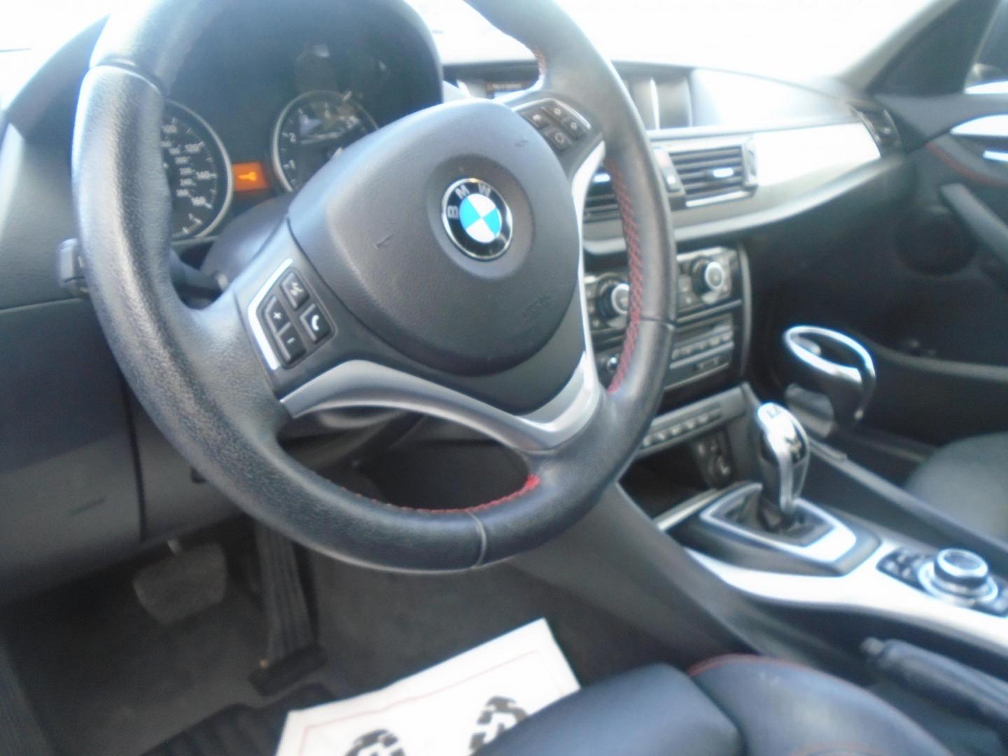2014 BMW X1 xDrive28i (WBAVL1C55EV) with an 2.0L L4 DOHC 16V engine, 8-Speed Automatic transmission, located at 6112 N Florida Avenue, Tampa, FL, 33604, (888) 521-5131, 27.954929, -82.459534 - Photo#9