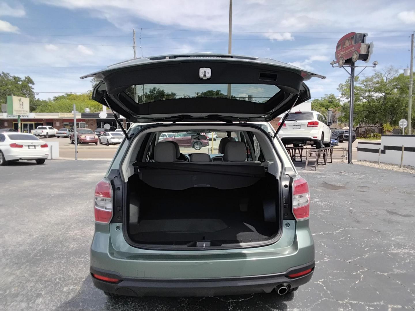 2015 GREEN /Beige Subaru Forester 2.5i Premium (JF2SJADC4FH) with an 2.5L H4 SOHC 16V engine, 6-Speed Automatic transmission, located at 6112 N Florida Avenue, Tampa, FL, 33604, (888) 521-5131, 27.954929, -82.459534 - 499$ DOWN PLUS TAX & TAG. - Photo#4