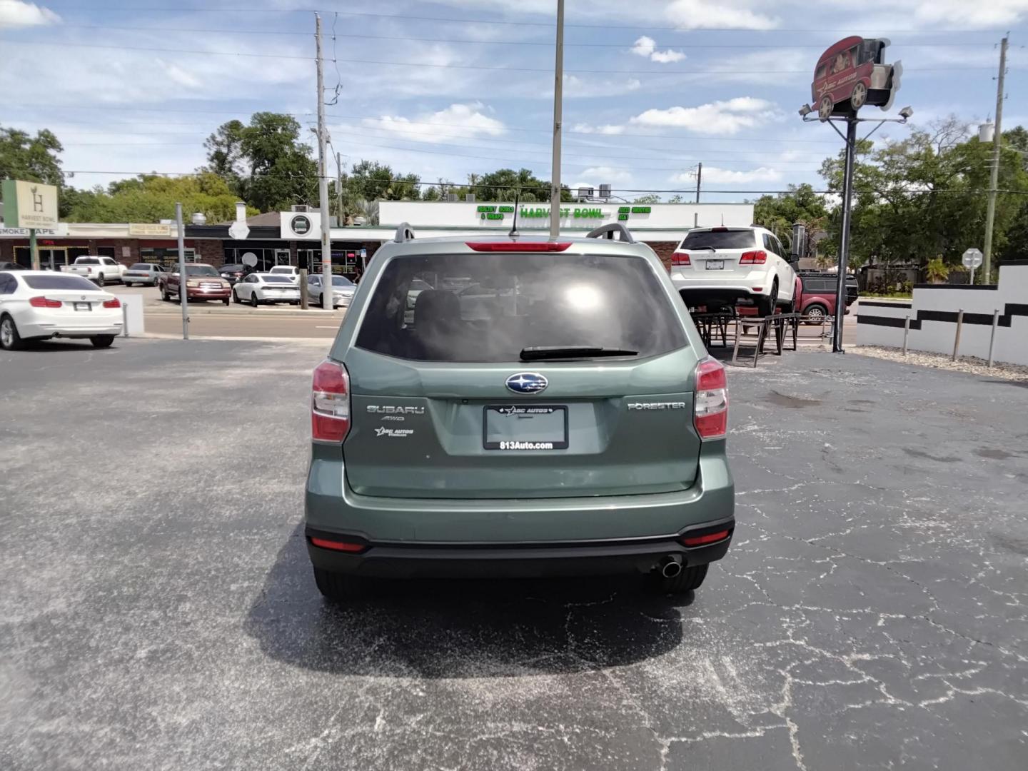 2015 GREEN /Beige Subaru Forester 2.5i Premium (JF2SJADC4FH) with an 2.5L H4 SOHC 16V engine, 6-Speed Automatic transmission, located at 6112 N Florida Avenue, Tampa, FL, 33604, (888) 521-5131, 27.954929, -82.459534 - 499$ DOWN PLUS TAX & TAG. - Photo#3