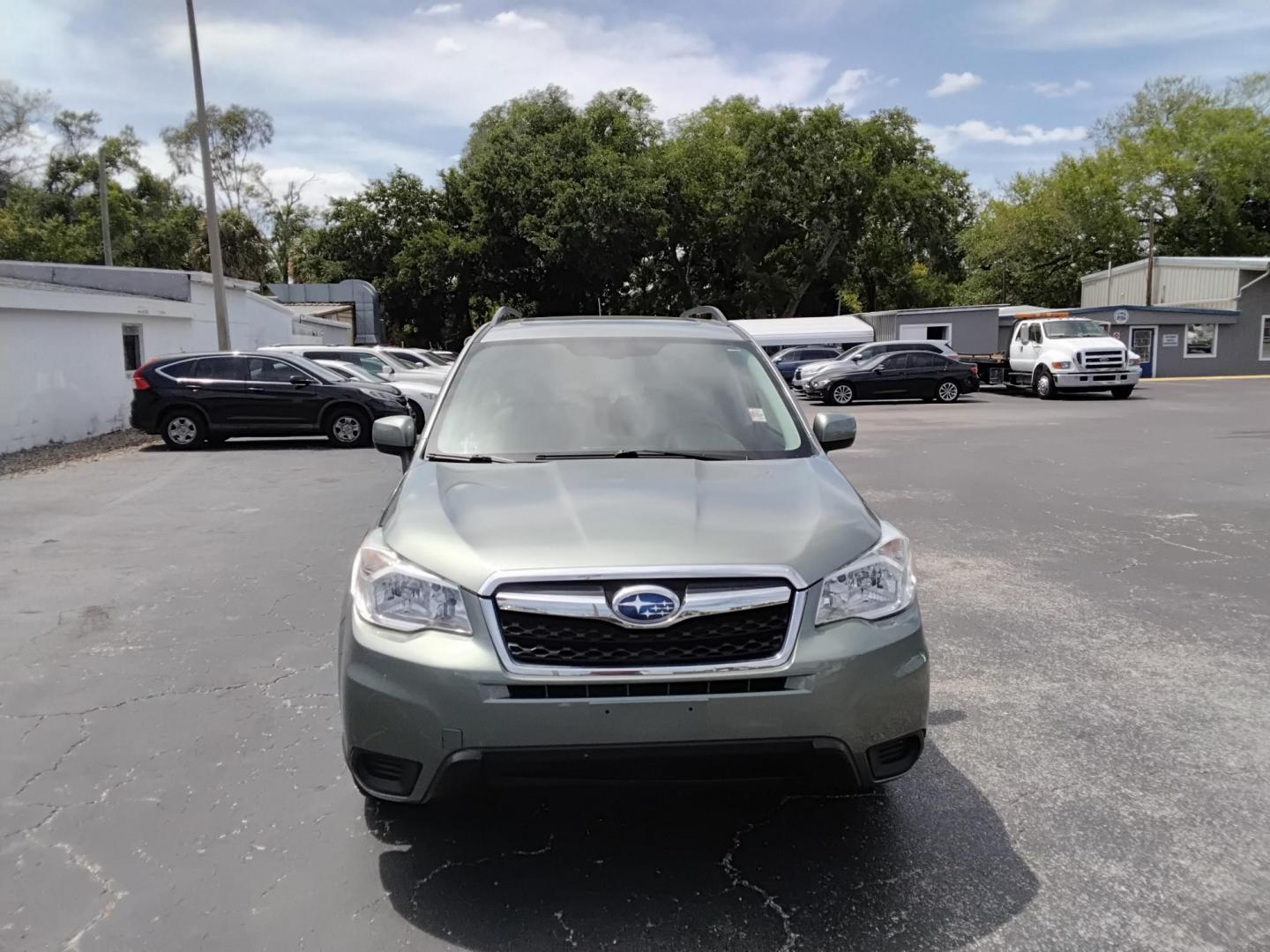 2015 GREEN /Beige Subaru Forester 2.5i Premium (JF2SJADC4FH) with an 2.5L H4 SOHC 16V engine, 6-Speed Automatic transmission, located at 6112 N Florida Avenue, Tampa, FL, 33604, (888) 521-5131, 27.954929, -82.459534 - 499$ DOWN PLUS TAX & TAG. - Photo#1