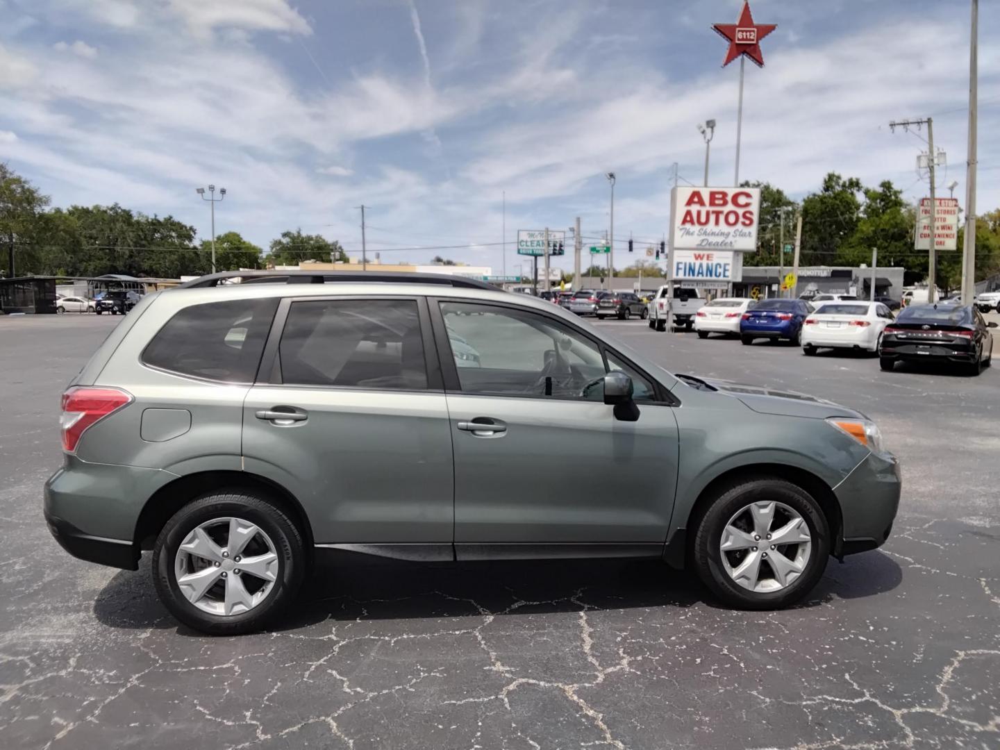 2015 GREEN /Beige Subaru Forester 2.5i Premium (JF2SJADC4FH) with an 2.5L H4 SOHC 16V engine, 6-Speed Automatic transmission, located at 6112 N Florida Avenue, Tampa, FL, 33604, (888) 521-5131, 27.954929, -82.459534 - 499$ DOWN PLUS TAX & TAG. - Photo#2