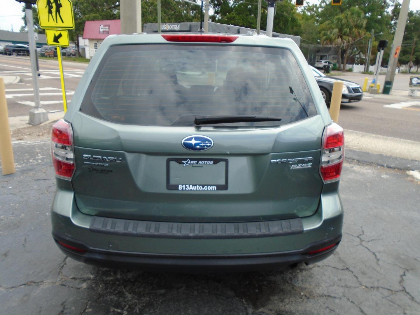2014 Subaru Forester 2.5i (JF2SJAAC3EH) with an 2.5L H4 SOHC 16V engine, 6-Speed Automatic transmission, located at 6112 N Florida Avenue, Tampa, FL, 33604, (888) 521-5131, 27.954929, -82.459534 - Photo#2
