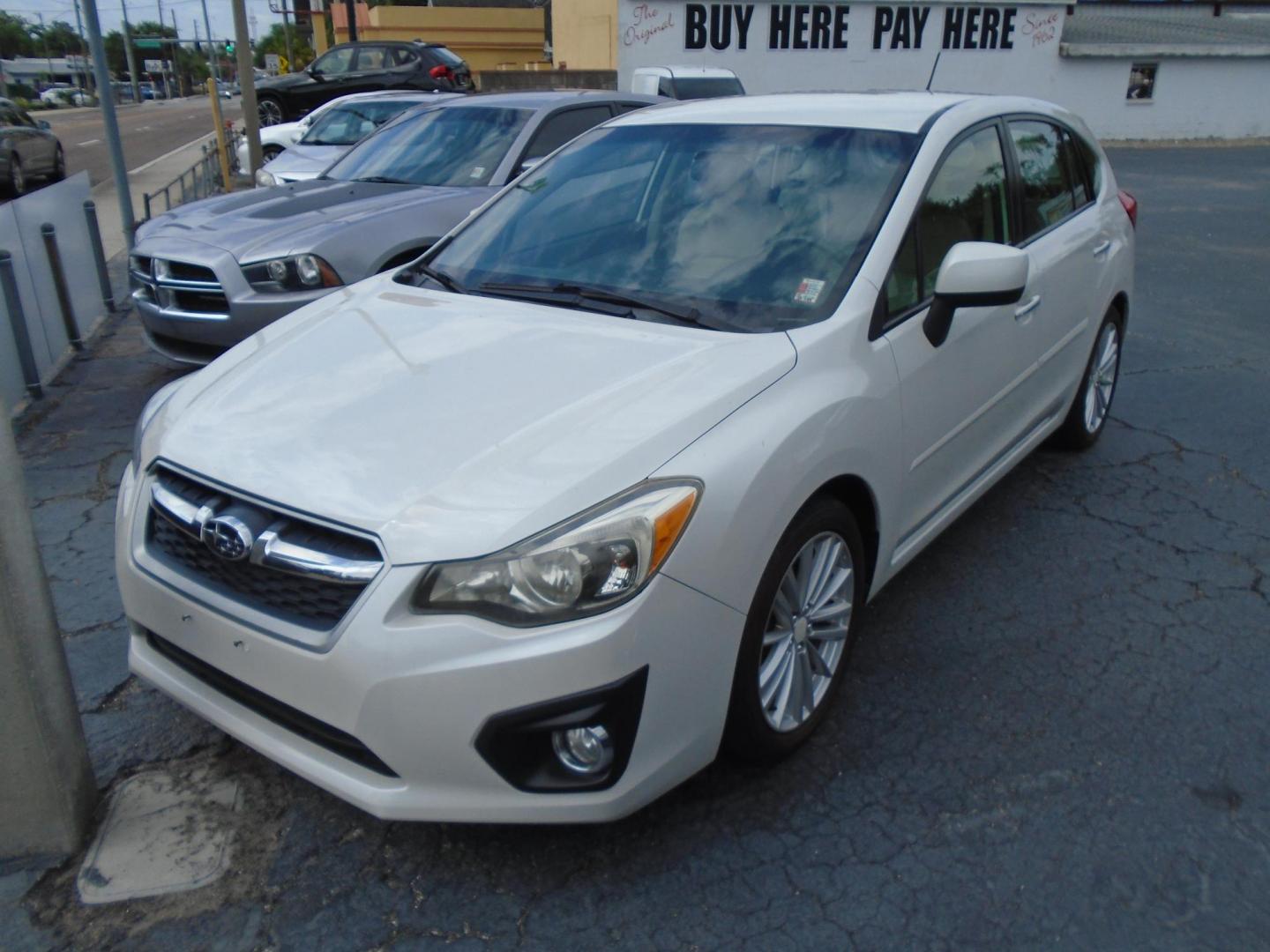 2012 Subaru Impreza Limited 5-Door (JF1GPAG64CH) with an 2.0L H4 DOHC 16V engine, Continuously Variable Transmission transmission, located at 6112 N Florida Avenue, Tampa, FL, 33604, (888) 521-5131, 27.954929, -82.459534 - Photo#1