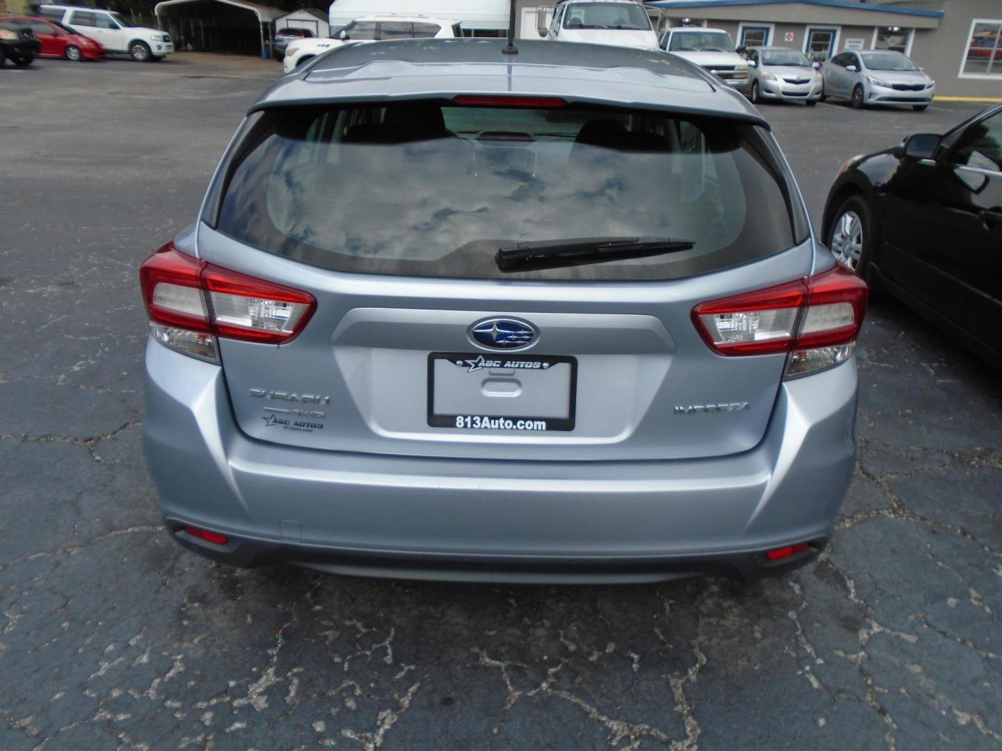 2018 Subaru Impreza 2.0i CVT 5-Door (4S3GTAA66J3) with an 2.0L H4 DOHC 16V engine, CVT transmission, located at 6112 N Florida Avenue, Tampa, FL, 33604, (888) 521-5131, 27.954929, -82.459534 - Photo#3