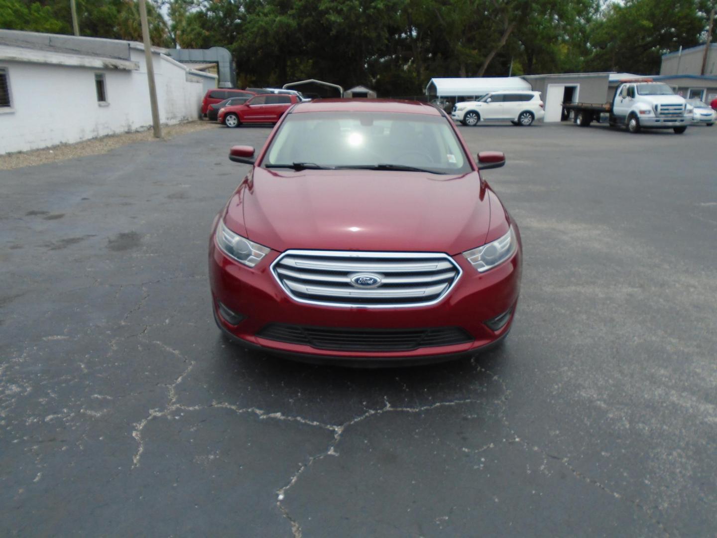 2015 Ford Taurus SEL FWD (1FAHP2E83FG) with an 3.5L V6 DOHC 24V engine, 6-Speed Automatic transmission, located at 6112 N Florida Avenue, Tampa, FL, 33604, (888) 521-5131, 27.954929, -82.459534 - Photo#1