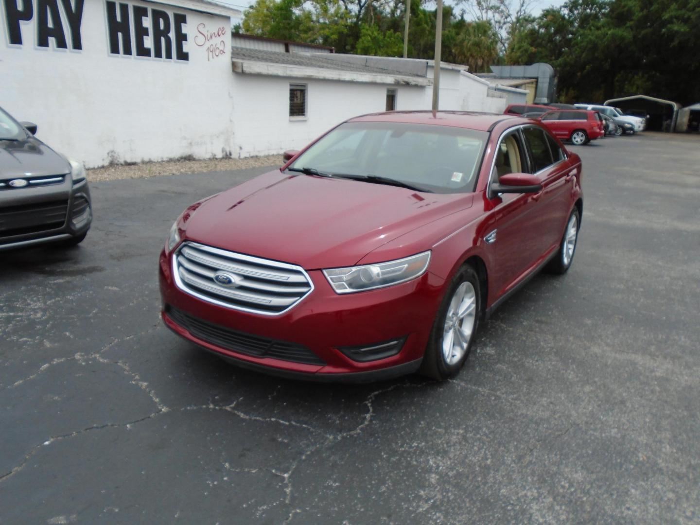 2015 Ford Taurus SEL FWD (1FAHP2E83FG) with an 3.5L V6 DOHC 24V engine, 6-Speed Automatic transmission, located at 6112 N Florida Avenue, Tampa, FL, 33604, (888) 521-5131, 27.954929, -82.459534 - Photo#2