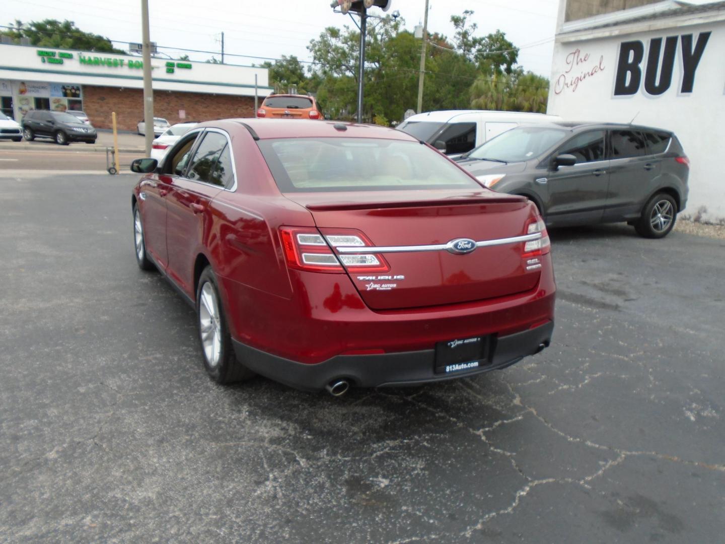 2015 Ford Taurus SEL FWD (1FAHP2E83FG) with an 3.5L V6 DOHC 24V engine, 6-Speed Automatic transmission, located at 6112 N Florida Avenue, Tampa, FL, 33604, (888) 521-5131, 27.954929, -82.459534 - Photo#5