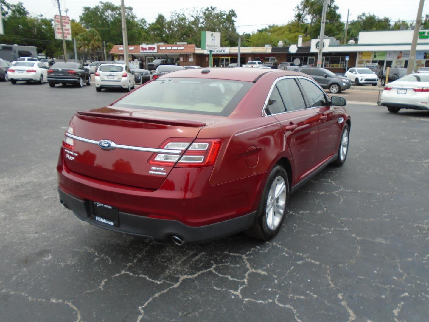2015 Ford Taurus SEL FWD (1FAHP2E83FG) with an 3.5L V6 DOHC 24V engine, 6-Speed Automatic transmission, located at 6112 N Florida Avenue, Tampa, FL, 33604, (888) 521-5131, 27.954929, -82.459534 - Photo#4