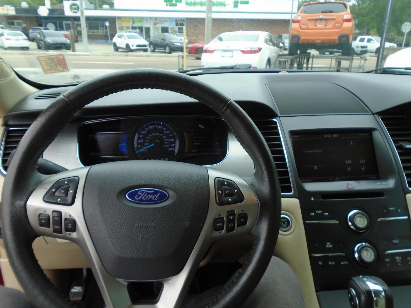 2015 Ford Taurus SEL FWD (1FAHP2E83FG) with an 3.5L V6 DOHC 24V engine, 6-Speed Automatic transmission, located at 6112 N Florida Avenue, Tampa, FL, 33604, (888) 521-5131, 27.954929, -82.459534 - Photo#12