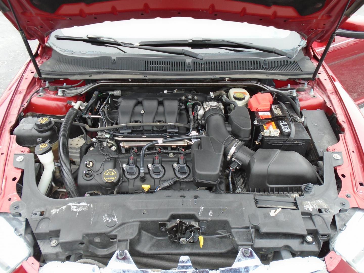 2015 Ford Taurus SEL FWD (1FAHP2E83FG) with an 3.5L V6 DOHC 24V engine, 6-Speed Automatic transmission, located at 6112 N Florida Avenue, Tampa, FL, 33604, (888) 521-5131, 27.954929, -82.459534 - Photo#11