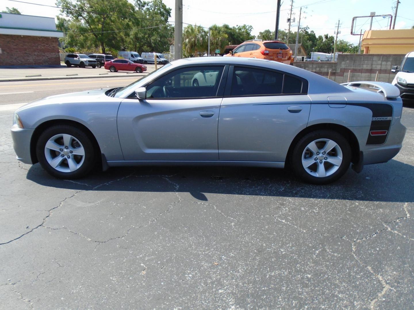 2014 Dodge Charger SE (2C3CDXBG6EH) with an 3.6L V6 DOHC 24V engine, 5-Speed Automatic transmission, located at 6112 N Florida Avenue, Tampa, FL, 33604, (888) 521-5131, 27.954929, -82.459534 - Photo#0