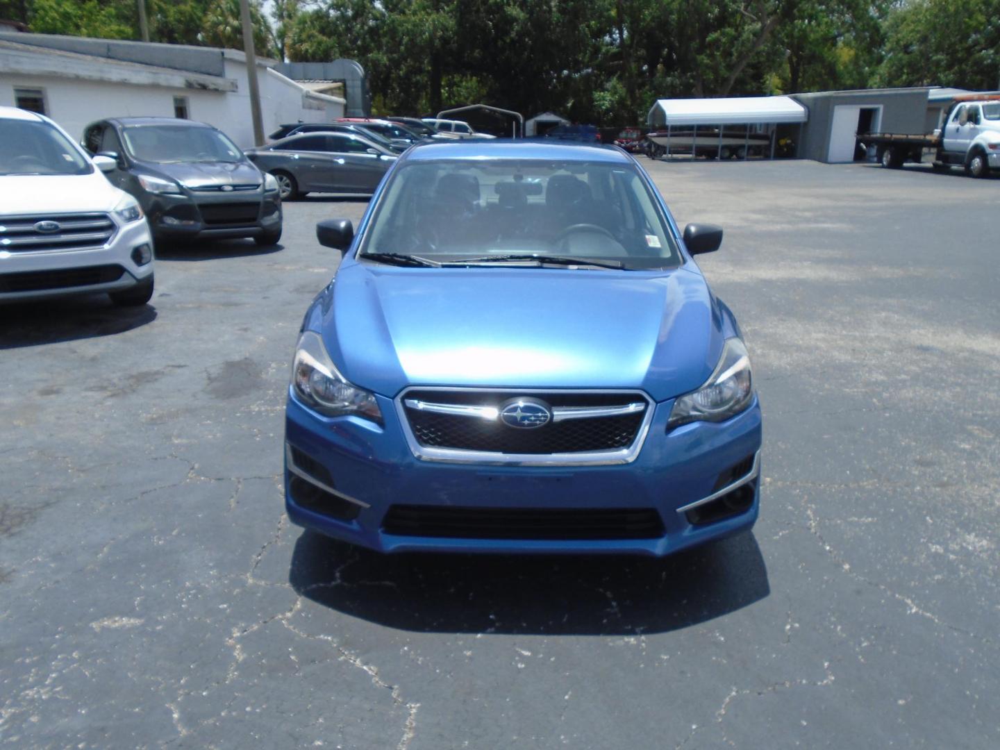2015 Subaru Impreza 2.0i PZEV CVT 4-Door (JF1GJAA66FH) with an 2.0L H4 DOHC 16V engine, Continuously Variable Transmission transmission, located at 6112 N Florida Avenue, Tampa, FL, 33604, (888) 521-5131, 27.954929, -82.459534 - Photo#1