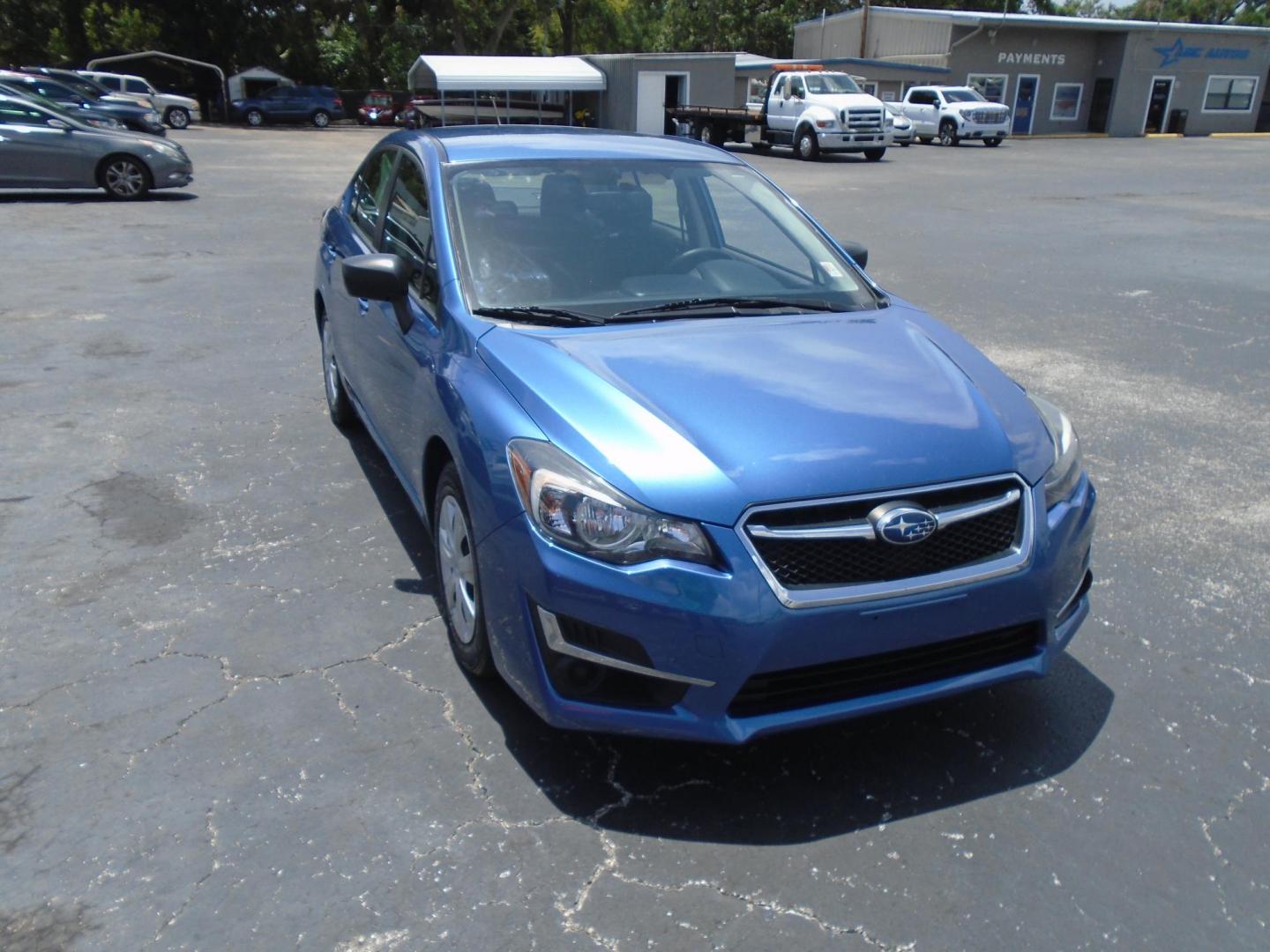 2015 Subaru Impreza 2.0i PZEV CVT 4-Door (JF1GJAA66FH) with an 2.0L H4 DOHC 16V engine, Continuously Variable Transmission transmission, located at 6112 N Florida Avenue, Tampa, FL, 33604, (888) 521-5131, 27.954929, -82.459534 - Photo#2