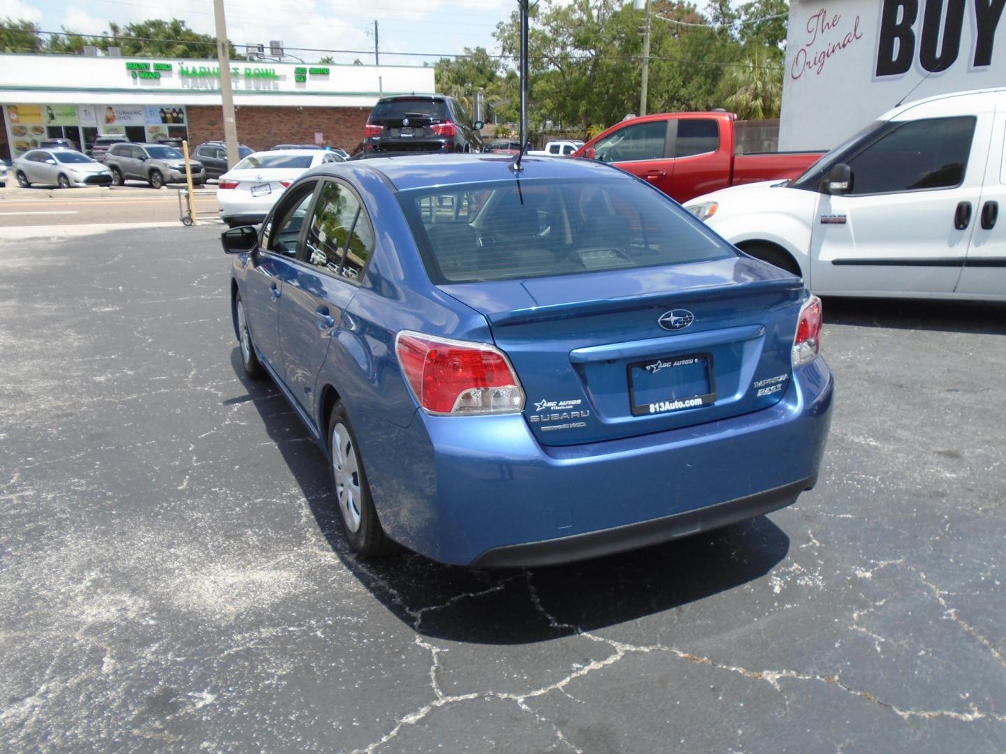 2015 Subaru Impreza 2.0i PZEV CVT 4-Door (JF1GJAA66FH) with an 2.0L H4 DOHC 16V engine, Continuously Variable Transmission transmission, located at 6112 N Florida Avenue, Tampa, FL, 33604, (888) 521-5131, 27.954929, -82.459534 - Photo#4