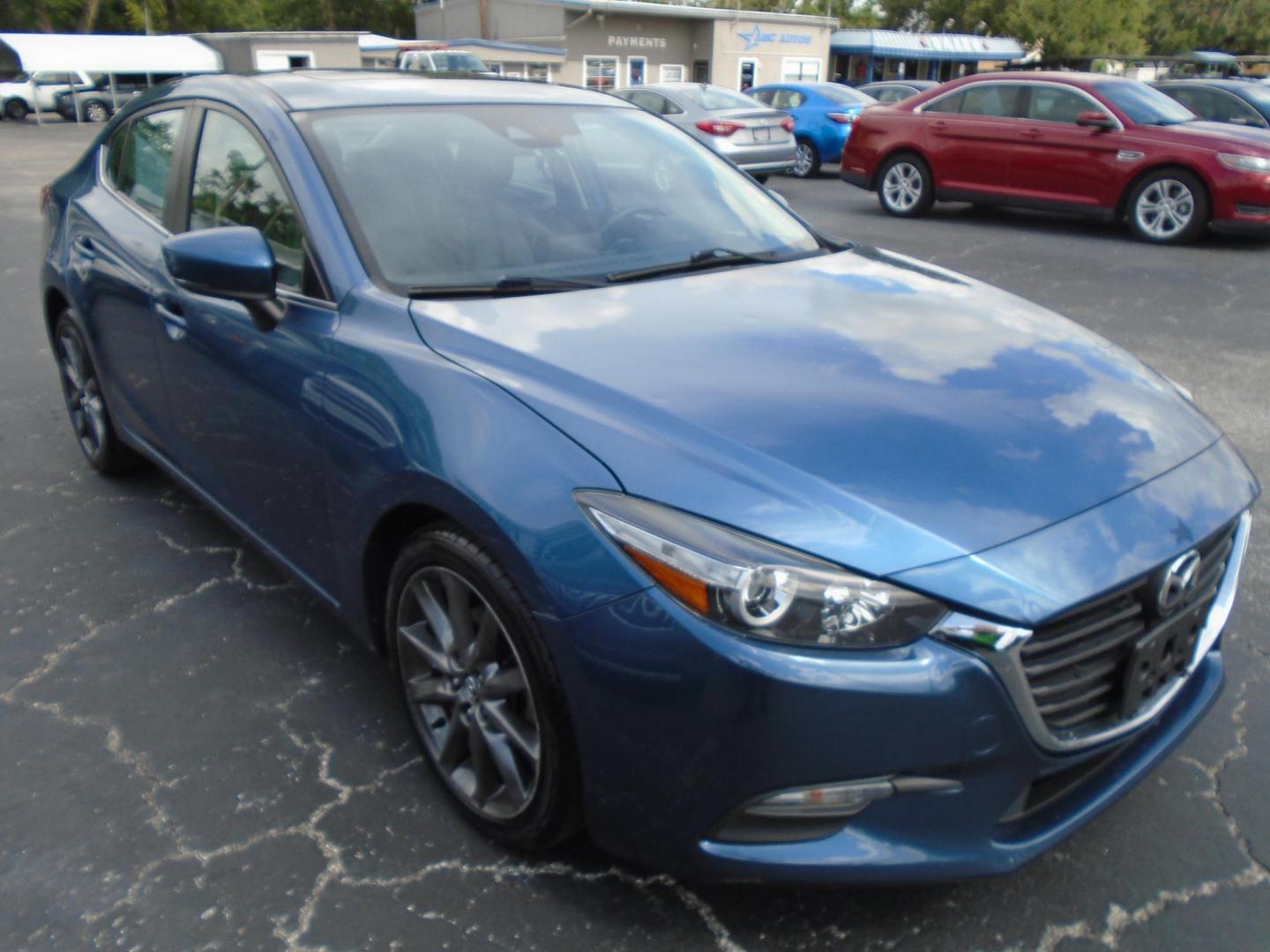 2018 Mazda MAZDA3 s Touring AT 4-Door (3MZBN1V36JM) with an 2.5L L4 DOHC 16V engine, 6A transmission, located at 6112 N Florida Avenue, Tampa, FL, 33604, (888) 521-5131, 27.954929, -82.459534 - Photo#2