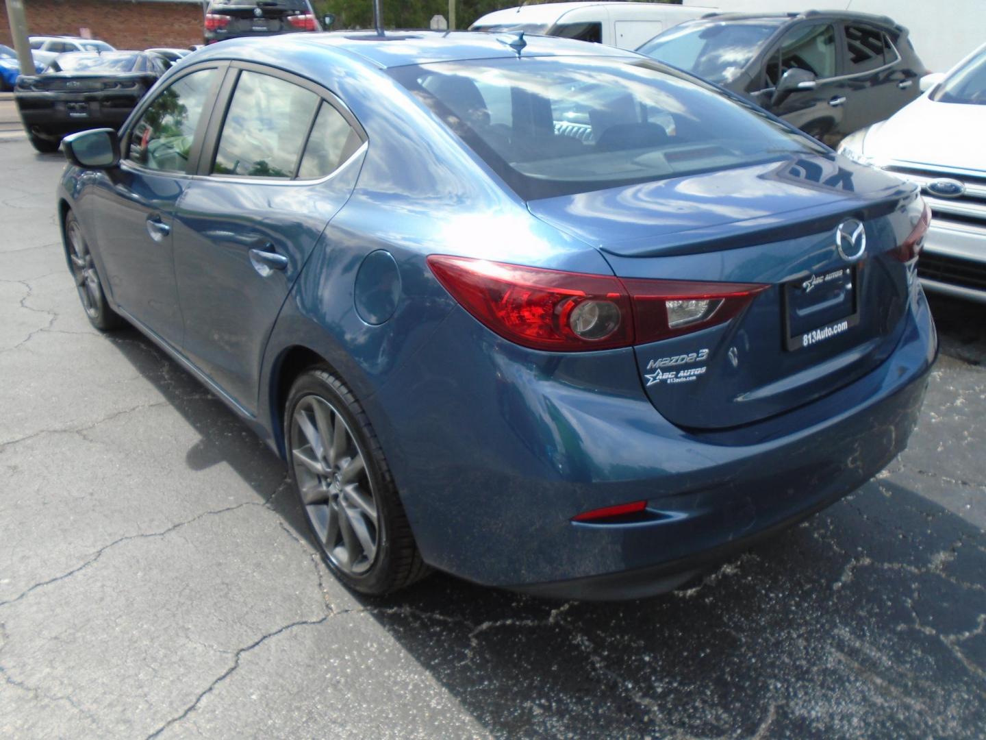 2018 Mazda MAZDA3 s Touring AT 4-Door (3MZBN1V36JM) with an 2.5L L4 DOHC 16V engine, 6A transmission, located at 6112 N Florida Avenue, Tampa, FL, 33604, (888) 521-5131, 27.954929, -82.459534 - Photo#4