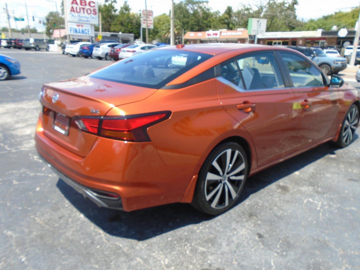 2019 orange /grey Nissan Altima 2.5 SR (1N4BL4CV6KC) with an 2.5L L4 DOHC 16V engine, CVT transmission, located at 6112 N Florida Avenue, Tampa, FL, 33604, (888) 521-5131, 27.954929, -82.459534 - 499 down plus tax & tag!!! - Photo#5