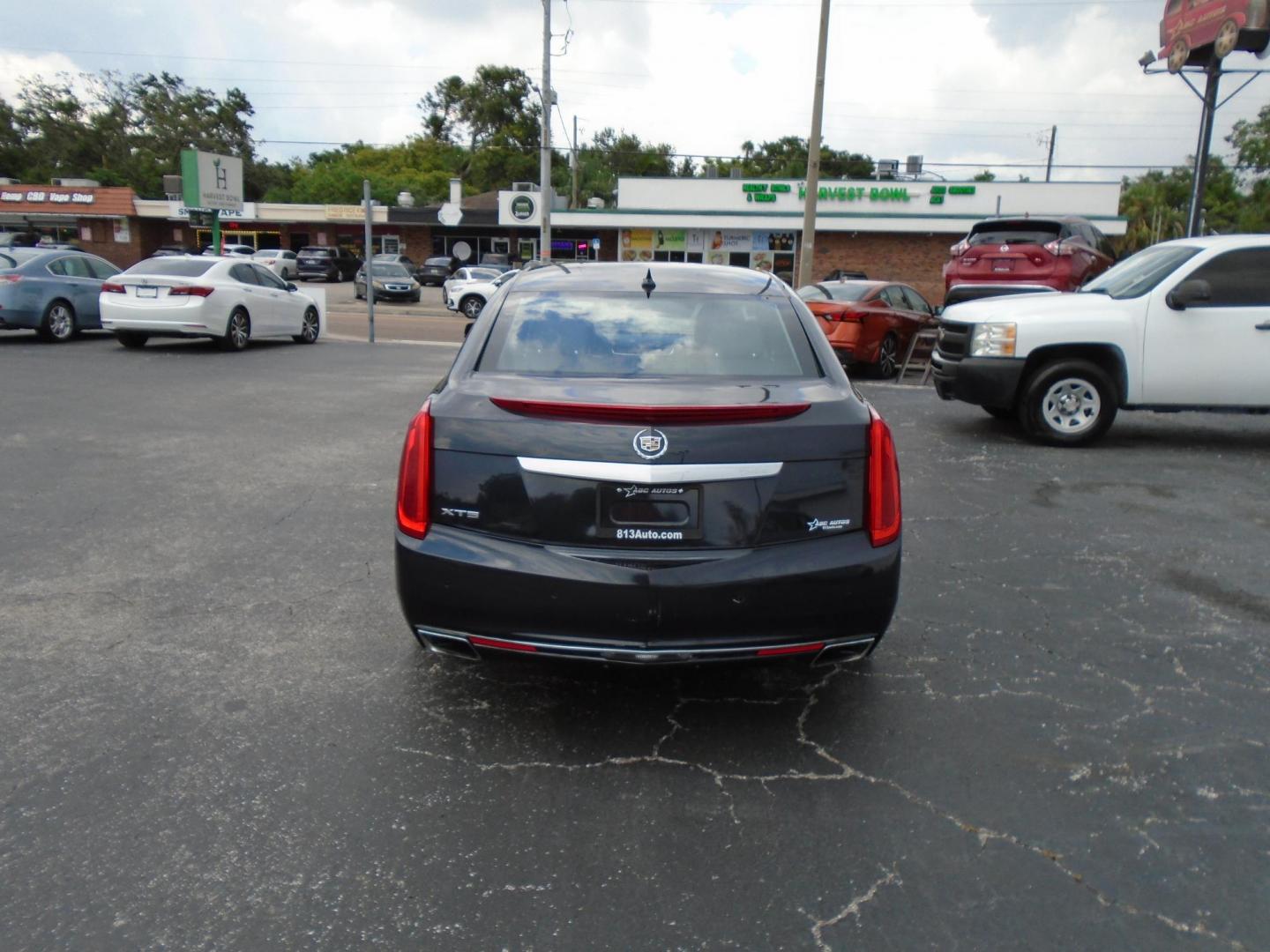 2014 BLUE /Beige Cadillac XTS Luxury FWD (2G61M5S39E9) with an 3.6L V6 DOHC 24V engine, 6-Speed Automatic transmission, located at 6112 N Florida Avenue, Tampa, FL, 33604, (888) 521-5131, 27.954929, -82.459534 - 499 DOWN PLUS TAX & TAG. - Photo#4