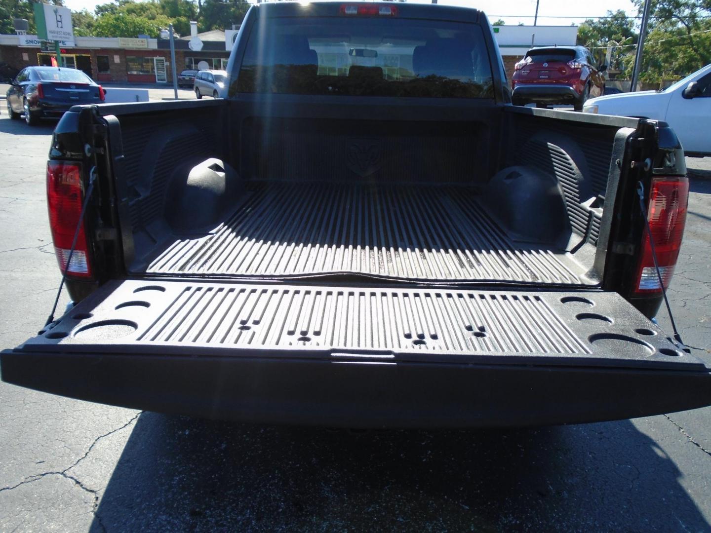 2012 BLACK /Grey Dodge Ram 1500 ST Quad Cab 2WD (1C6RD6FK0CS) with an 3.7L V6 SOHC 12V engine, 6-Speed Automatic transmission, located at 6112 N Florida Avenue, Tampa, FL, 33604, (888) 521-5131, 27.954929, -82.459534 - 499 DOWN PLUS TAX &TAG - Photo#7