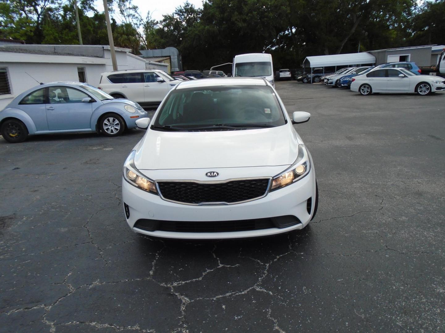 2017 White /Black Kia Forte LX 6M (3KPFK4A7XHE) with an 2.0L L4 DOHC 16V engine, 6M transmission, located at 6112 N Florida Avenue, Tampa, FL, 33604, (888) 521-5131, 27.954929, -82.459534 - 499 DOWN PLUS TAX & TAG - Photo#0