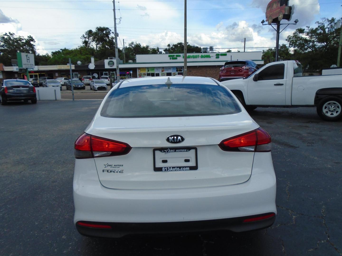 2017 White /Black Kia Forte LX 6M (3KPFK4A7XHE) with an 2.0L L4 DOHC 16V engine, 6M transmission, located at 6112 N Florida Avenue, Tampa, FL, 33604, (888) 521-5131, 27.954929, -82.459534 - 499 DOWN PLUS TAX & TAG - Photo#3