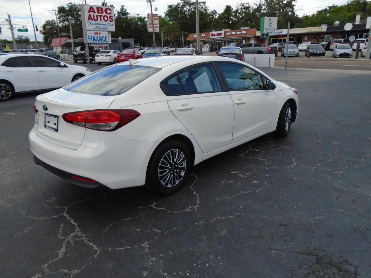2017 White /Black Kia Forte LX 6M (3KPFK4A7XHE) with an 2.0L L4 DOHC 16V engine, 6M transmission, located at 6112 N Florida Avenue, Tampa, FL, 33604, (888) 521-5131, 27.954929, -82.459534 - 499 DOWN PLUS TAX & TAG - Photo#4