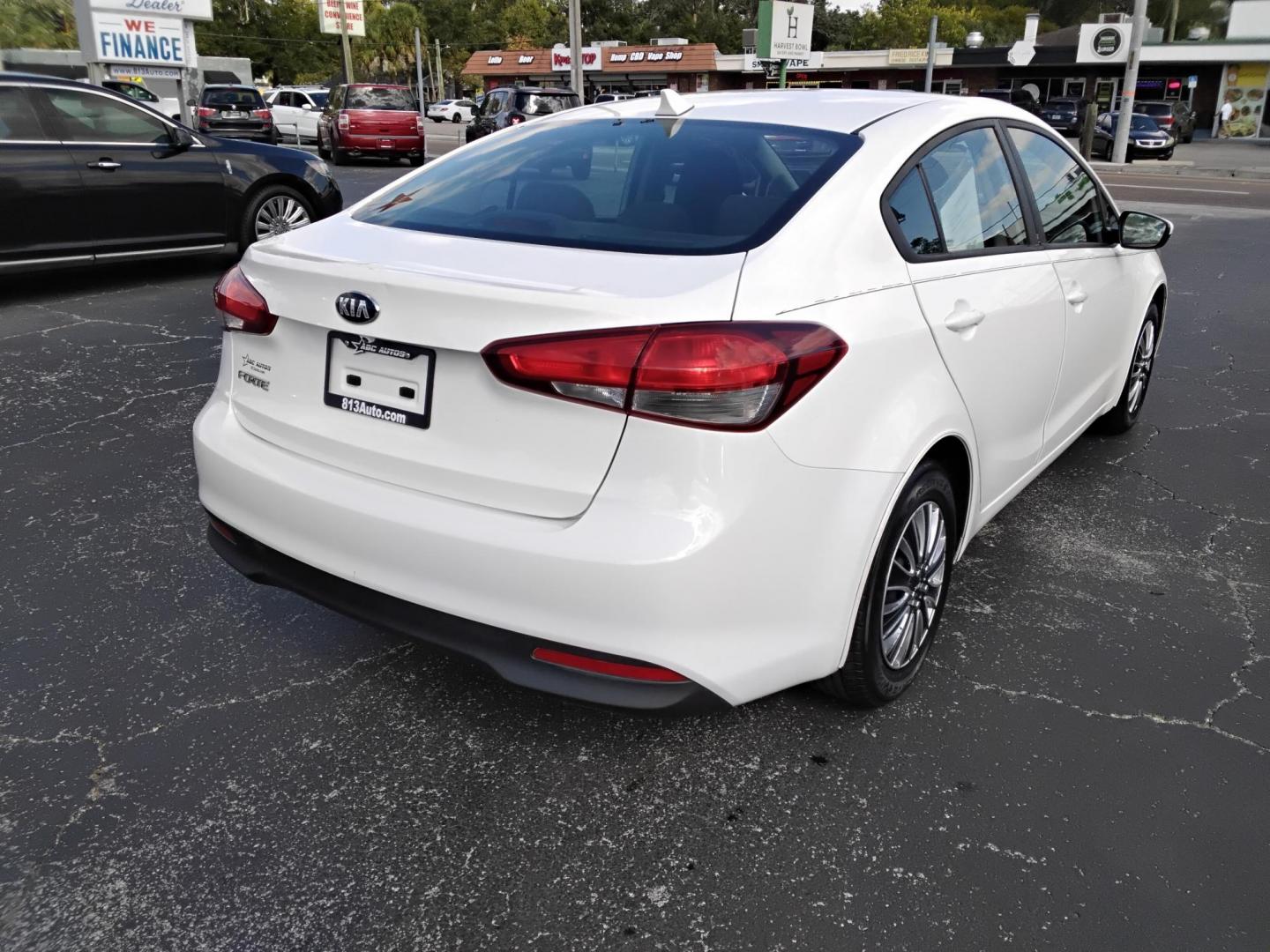 2017 White /Black Kia Forte LX 6M (3KPFK4A7XHE) with an 2.0L L4 DOHC 16V engine, 6M transmission, located at 6112 N Florida Avenue, Tampa, FL, 33604, (888) 521-5131, 27.954929, -82.459534 - 499 DOWN PLUS TAX & TAG. - Photo#5