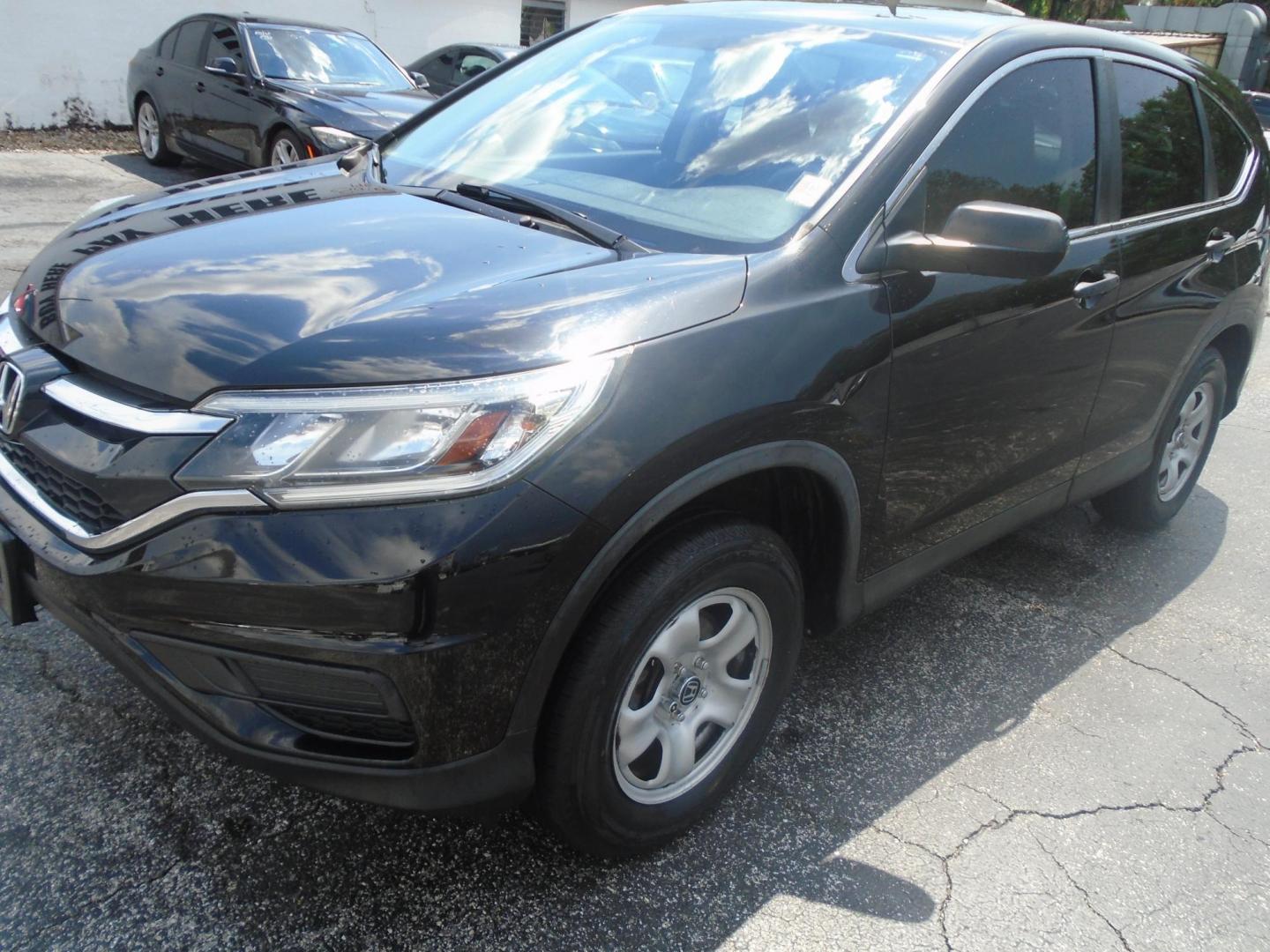 2016 BLACK /GREY Honda CR-V LX AWD (5J6RM4H31GL) with an 2.4L L4 DOHC 16V engine, CVT transmission, located at 6112 N Florida Avenue, Tampa, FL, 33604, (888) 521-5131, 27.954929, -82.459534 - 499$ DOWN PLUS TAX & TAG. - Photo#2