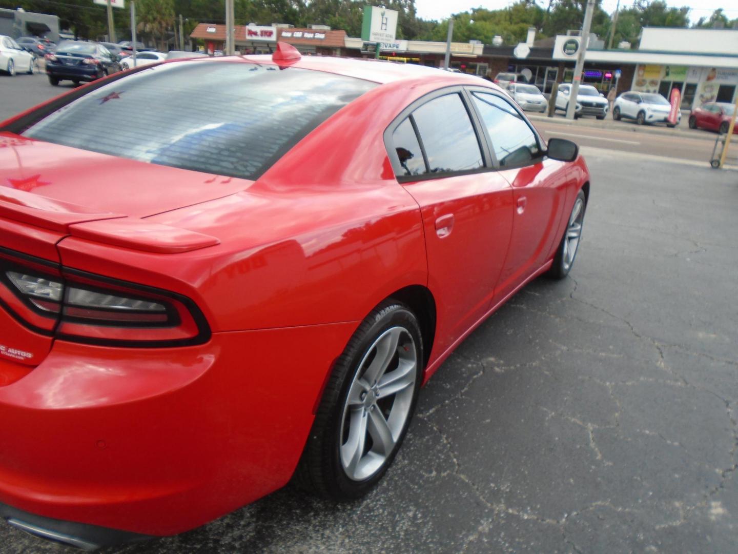 2015 RED /BLACK Dodge Charger SXT (2C3CDXHG9FH) with an 3.6L V6 DOHC 24V engine, 8-Speed Automatic transmission, located at 6112 N Florida Avenue, Tampa, FL, 33604, (888) 521-5131, 27.954929, -82.459534 - Just 499$ down plus tax & tag. - Photo#2