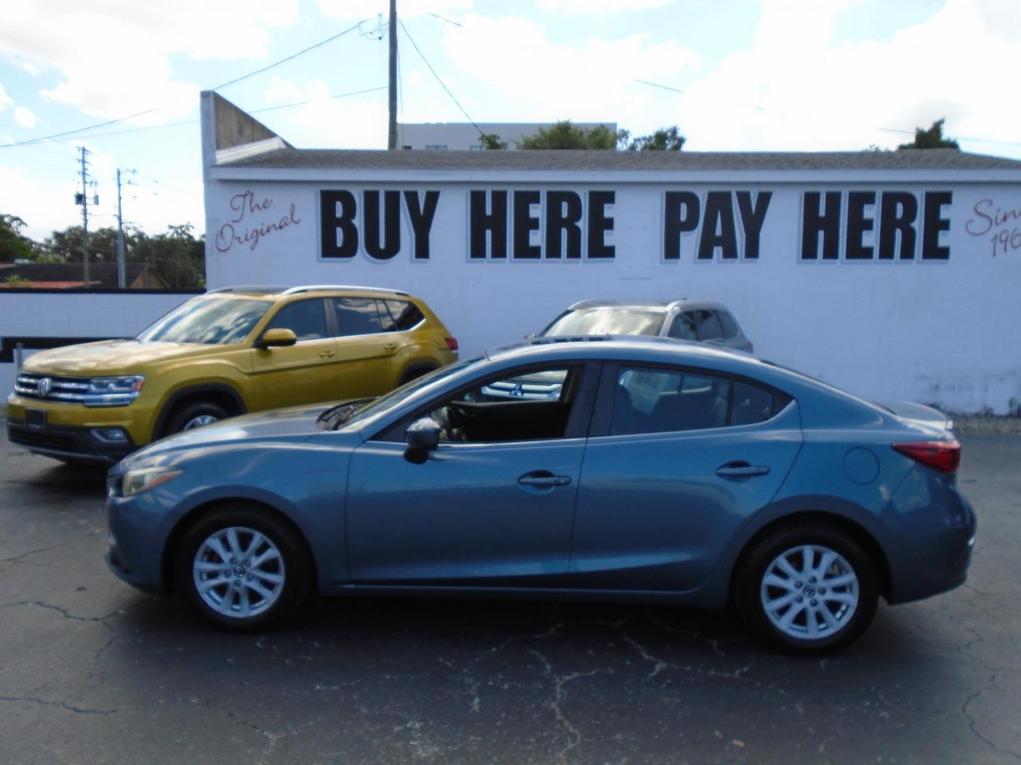 2015 Blue /106470 Mazda MAZDA3 i Grand Touring MT 4-Door (JM1BM1W7XF1) with an 2.0L L4 DOHC 16V engine, 6-Speed Manual transmission, located at 6112 N Florida Avenue, Tampa, FL, 33604, (888) 521-5131, 27.954929, -82.459534 - $499 down plus tax & tag. - Photo#1