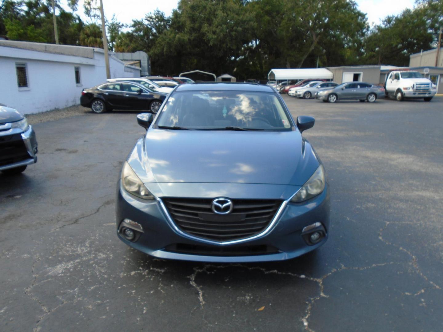 2015 Blue /106470 Mazda MAZDA3 i Grand Touring MT 4-Door (JM1BM1W7XF1) with an 2.0L L4 DOHC 16V engine, 6-Speed Manual transmission, located at 6112 N Florida Avenue, Tampa, FL, 33604, (888) 521-5131, 27.954929, -82.459534 - $499 down plus tax & tag. - Photo#2