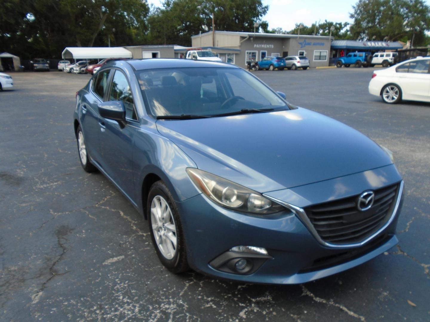 2015 Blue /106470 Mazda MAZDA3 i Grand Touring MT 4-Door (JM1BM1W7XF1) with an 2.0L L4 DOHC 16V engine, 6-Speed Manual transmission, located at 6112 N Florida Avenue, Tampa, FL, 33604, (888) 521-5131, 27.954929, -82.459534 - $499 down plus tax & tag. - Photo#4