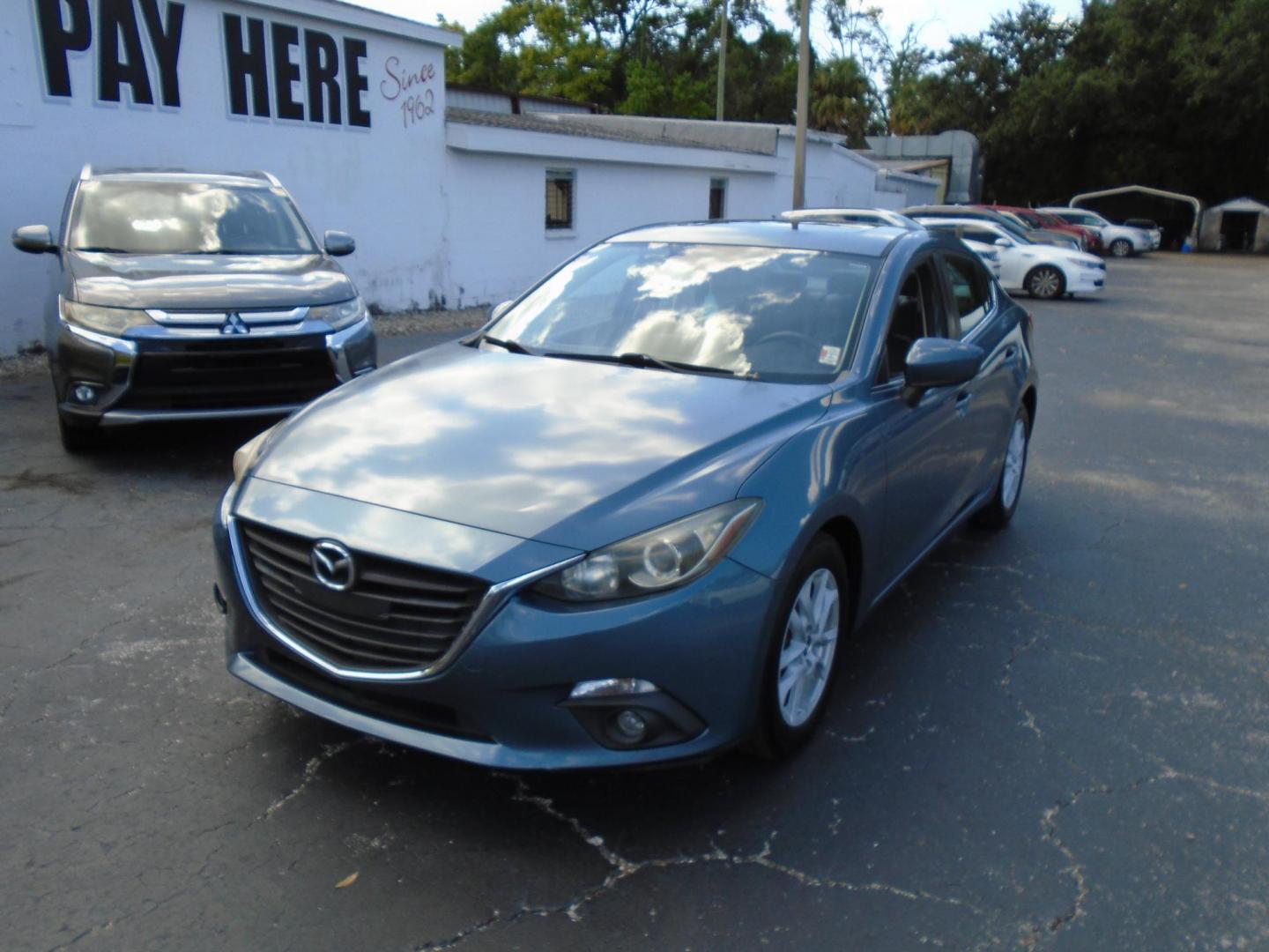2015 Blue /106470 Mazda MAZDA3 i Grand Touring MT 4-Door (JM1BM1W7XF1) with an 2.0L L4 DOHC 16V engine, 6-Speed Manual transmission, located at 6112 N Florida Avenue, Tampa, FL, 33604, (888) 521-5131, 27.954929, -82.459534 - $499 down plus tax & tag. - Photo#3
