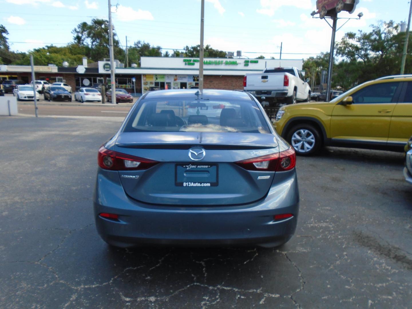 2015 Blue /106470 Mazda MAZDA3 i Grand Touring MT 4-Door (JM1BM1W7XF1) with an 2.0L L4 DOHC 16V engine, 6-Speed Manual transmission, located at 6112 N Florida Avenue, Tampa, FL, 33604, (888) 521-5131, 27.954929, -82.459534 - $499 down plus tax & tag. - Photo#5