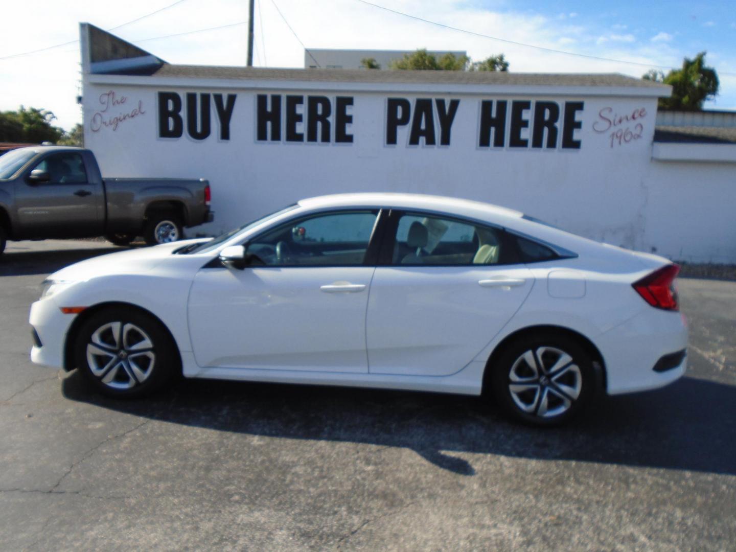 2016 White /Beige Honda Civic LX Sedan CVT (2HGFC2F51GH) with an 2.0L L4 DOHC 16V engine, CVT transmission, located at 6112 N Florida Avenue, Tampa, FL, 33604, (888) 521-5131, 27.954929, -82.459534 - 499$ down plus tax & tag. - Photo#0
