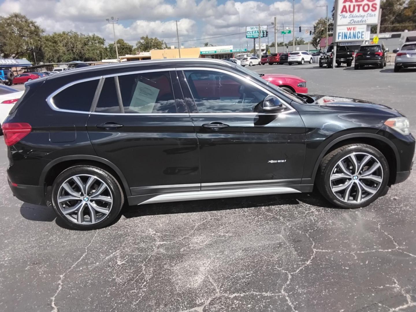 2017 BLACK /Black BMW X1 xDrive28i (WBXHT3C37H5) with an 2.0L L4 DOHC 16V engine, 8A transmission, located at 6112 N Florida Avenue, Tampa, FL, 33604, (888) 521-5131, 27.954929, -82.459534 - 499$ down plus tax & tag. - Photo#4