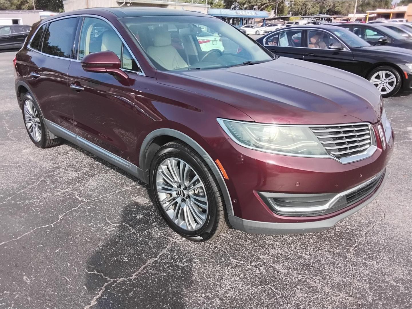 2017 RED LT /Beige Lincoln MKX Reserve (2LMPJ6LR8HB) with an 3.7L V6 DOHC 24V engine, 6A transmission, located at 6112 N Florida Avenue, Tampa, FL, 33604, (888) 521-5131, 27.954929, -82.459534 - 499$ DOWN PLUS TAX & TAG. - Photo#2