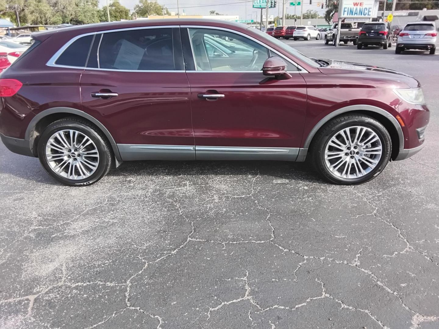 2017 RED LT /Beige Lincoln MKX Reserve (2LMPJ6LR8HB) with an 3.7L V6 DOHC 24V engine, 6A transmission, located at 6112 N Florida Avenue, Tampa, FL, 33604, (888) 521-5131, 27.954929, -82.459534 - 499$ DOWN PLUS TAX & TAG. - Photo#3