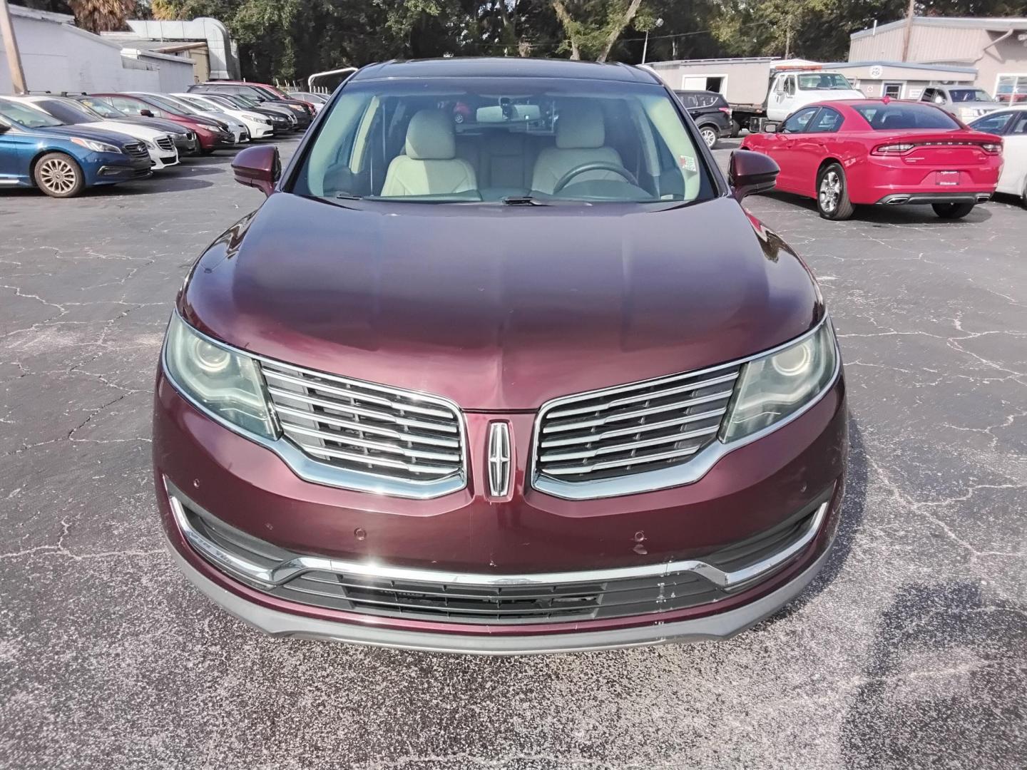 2017 RED LT /Beige Lincoln MKX Reserve (2LMPJ6LR8HB) with an 3.7L V6 DOHC 24V engine, 6A transmission, located at 6112 N Florida Avenue, Tampa, FL, 33604, (888) 521-5131, 27.954929, -82.459534 - 499$ DOWN PLUS TAX & TAG. - Photo#4