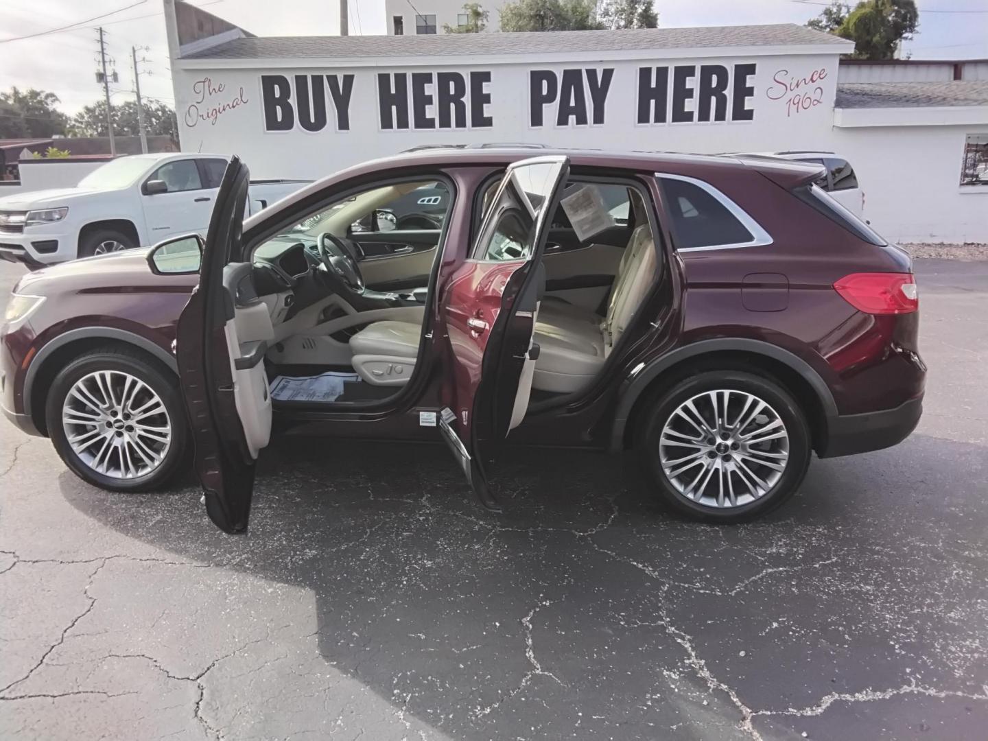 2017 RED LT /Beige Lincoln MKX Reserve (2LMPJ6LR8HB) with an 3.7L V6 DOHC 24V engine, 6A transmission, located at 6112 N Florida Avenue, Tampa, FL, 33604, (888) 521-5131, 27.954929, -82.459534 - 499$ DOWN PLUS TAX & TAG. - Photo#1