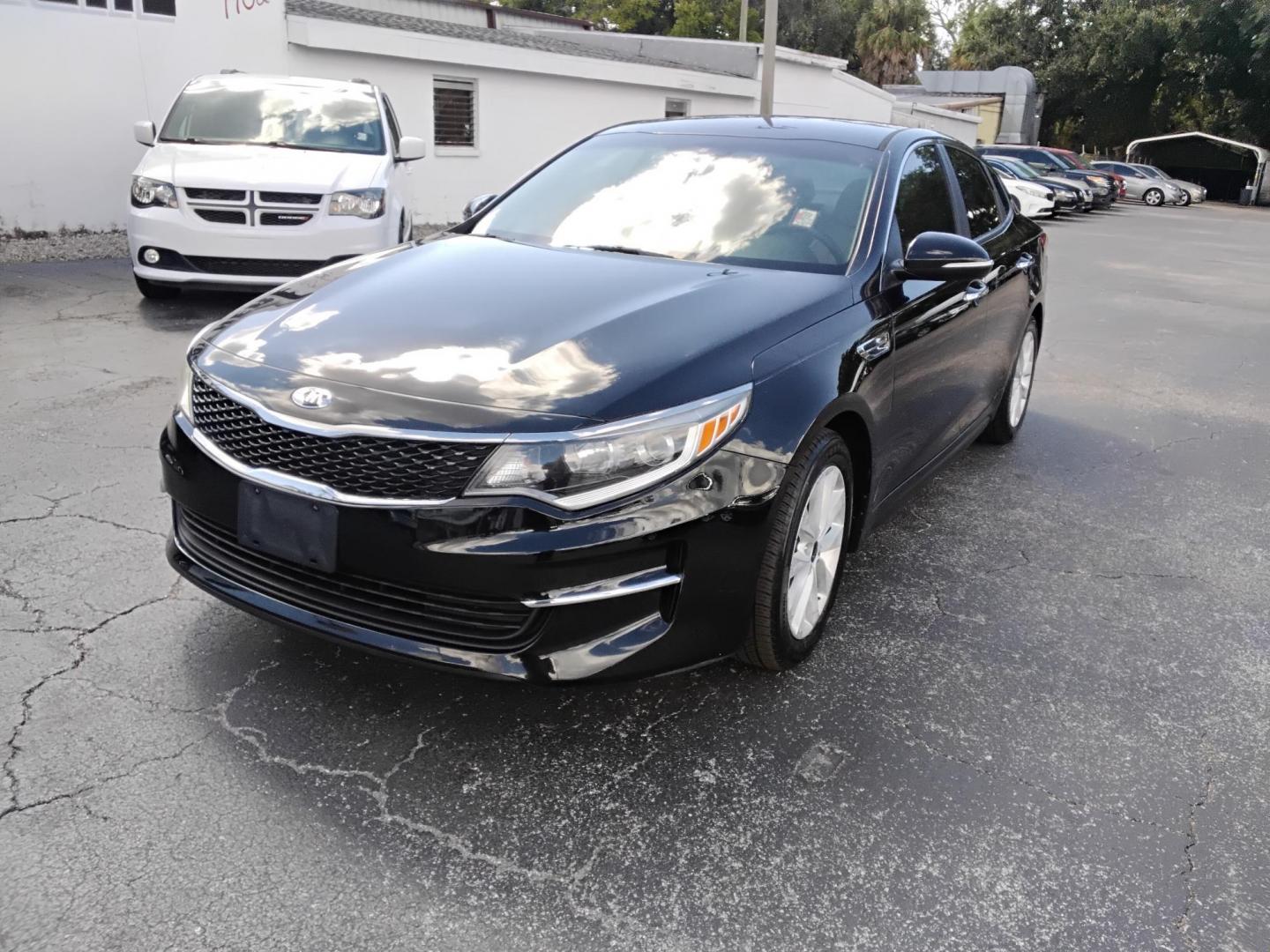 2018 BLACK /Grey Kia Optima LX (5XXGT4L35JG) with an 2.4L L4 DOHC 16V engine, 6A transmission, located at 6112 N Florida Avenue, Tampa, FL, 33604, (888) 521-5131, 27.954929, -82.459534 - 499$ DOWN PLUS TAX & TAG. - Photo#2