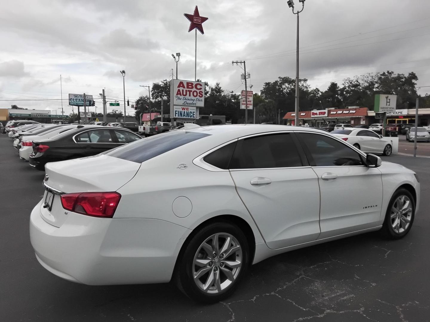 2017 White /Grey Chevrolet Impala LT (2G1105SA0H9) with an 2.5L L4 DOHC 16V engine, 6A transmission, located at 6112 N Florida Avenue, Tampa, FL, 33604, (888) 521-5131, 27.954929, -82.459534 - $499 DOWN PLUS TAX & TAG. - Photo#4
