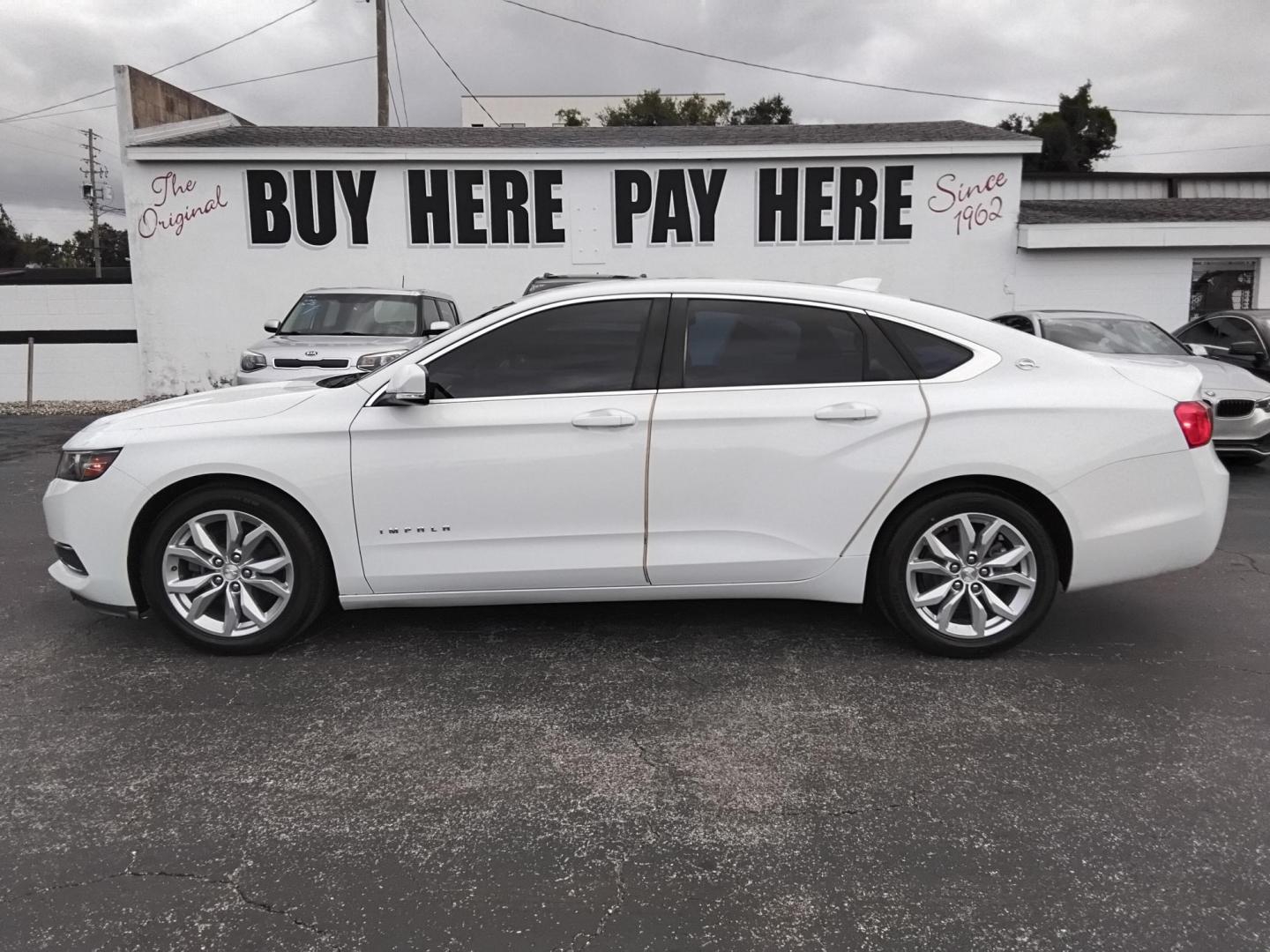 2017 White /Grey Chevrolet Impala LT (2G1105SA0H9) with an 2.5L L4 DOHC 16V engine, 6A transmission, located at 6112 N Florida Avenue, Tampa, FL, 33604, (888) 521-5131, 27.954929, -82.459534 - $499 DOWN PLUS TAX & TAG. - Photo#0