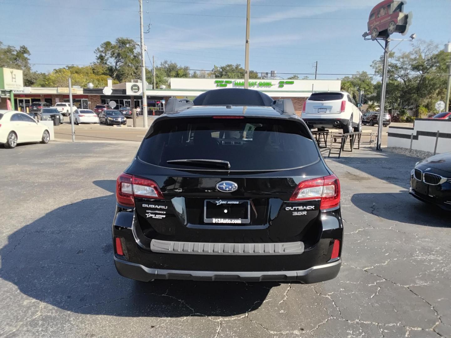 2015 BLACK /Black Subaru Outback 3.6R Limited (4S4BSENCXF3) with an 3.6L H6 DOHC 24V engine, 6-Speed Automatic transmission, located at 6112 N Florida Avenue, Tampa, FL, 33604, (888) 521-5131, 27.954929, -82.459534 - $499 DOWN PLUS TAX & TAG. - Photo#3