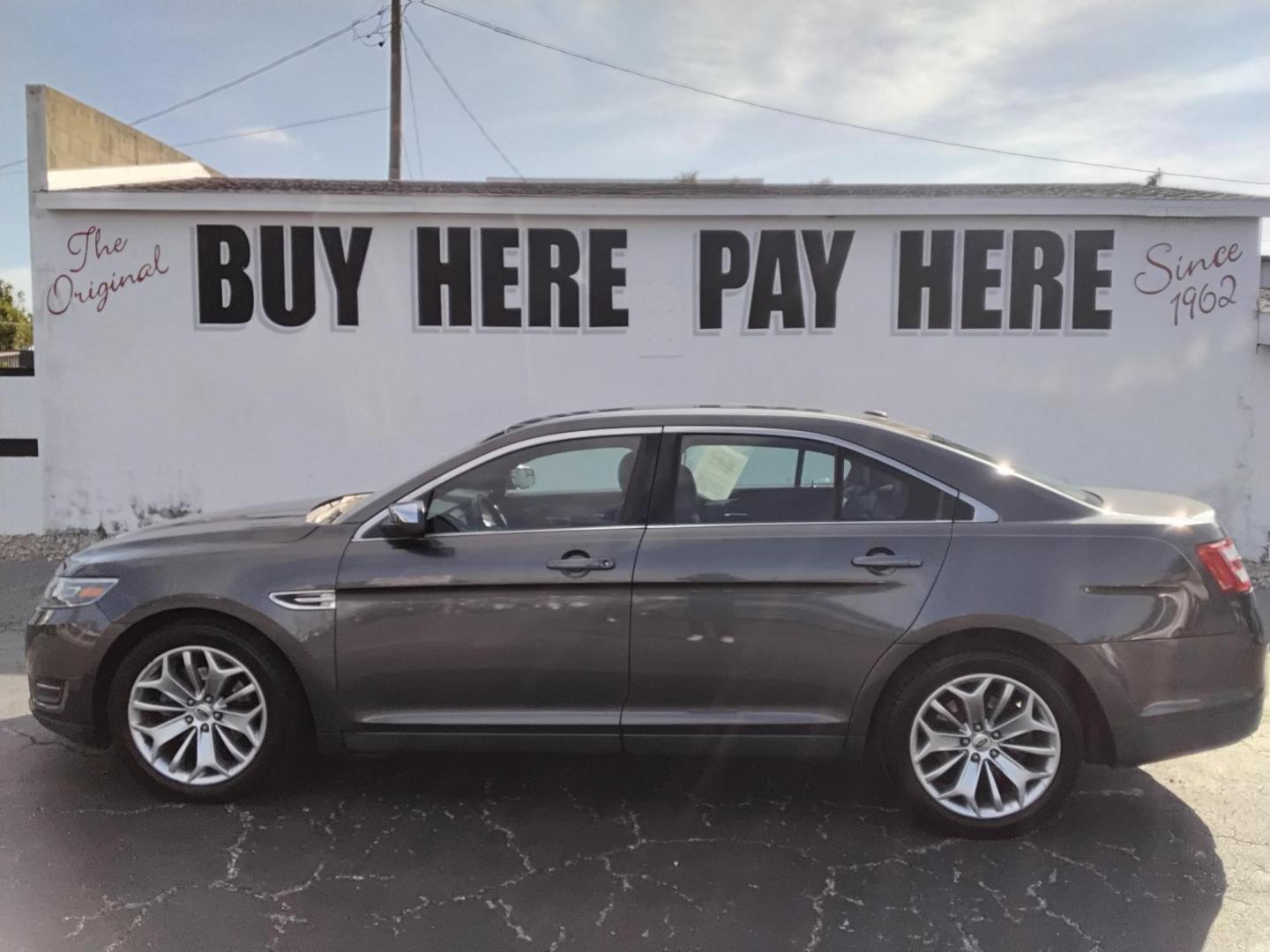 2016 GRAY /Grey Ford Taurus Limited FWD (1FAHP2F80GG) with an 3.5L V6 DOHC 24V engine, 6A transmission, located at 6112 N Florida Avenue, Tampa, FL, 33604, (888) 521-5131, 27.954929, -82.459534 - $499 down plus tax & tag. - Photo#0