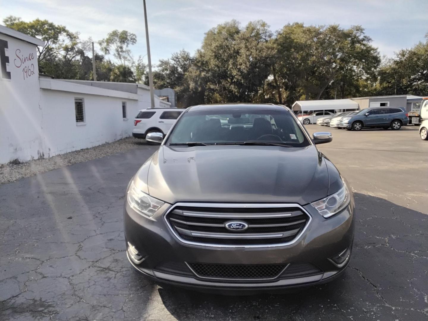 2016 GRAY /Grey Ford Taurus Limited FWD (1FAHP2F80GG) with an 3.5L V6 DOHC 24V engine, 6A transmission, located at 6112 N Florida Avenue, Tampa, FL, 33604, (888) 521-5131, 27.954929, -82.459534 - $499 down plus tax & tag. - Photo#1