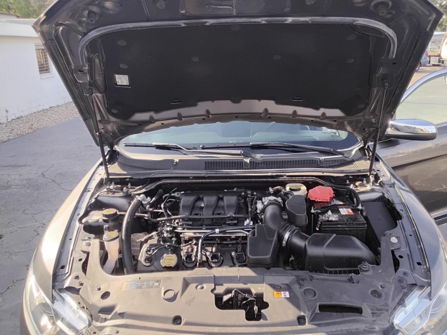 2016 GRAY /Grey Ford Taurus Limited FWD (1FAHP2F80GG) with an 3.5L V6 DOHC 24V engine, 6A transmission, located at 6112 N Florida Avenue, Tampa, FL, 33604, (888) 521-5131, 27.954929, -82.459534 - $499 down plus tax & tag. - Photo#12