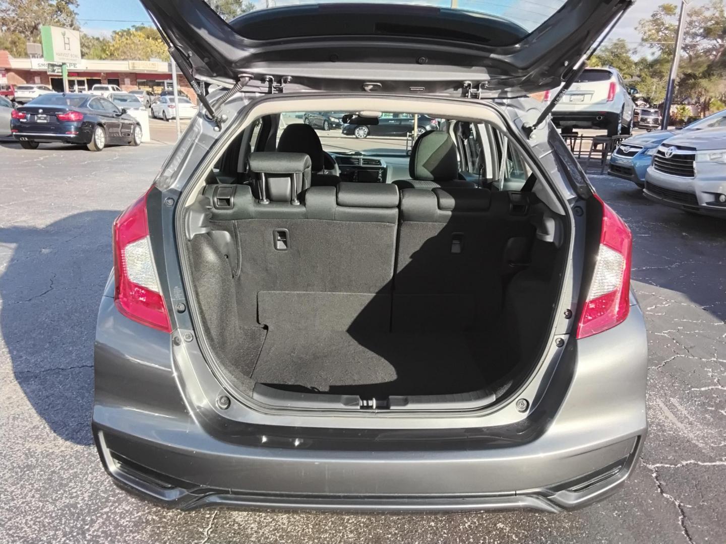 2019 GRAY /Grey Honda Fit LX CVT (3HGGK5H42KM) with an 1.5L L4 SOHC 16V engine, CVT transmission, located at 6112 N Florida Avenue, Tampa, FL, 33604, (888) 521-5131, 27.954929, -82.459534 - $499 DOWN PLUS TAX & TAG. - Photo#4