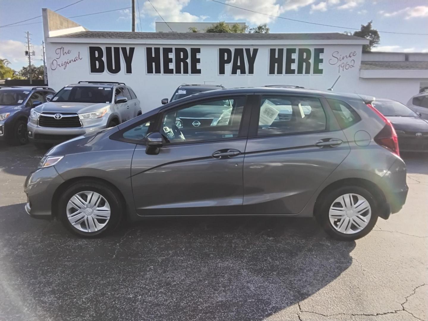 2019 GRAY /Grey Honda Fit LX CVT (3HGGK5H42KM) with an 1.5L L4 SOHC 16V engine, CVT transmission, located at 6112 N Florida Avenue, Tampa, FL, 33604, (888) 521-5131, 27.954929, -82.459534 - $499 DOWN PLUS TAX & TAG. - Photo#0