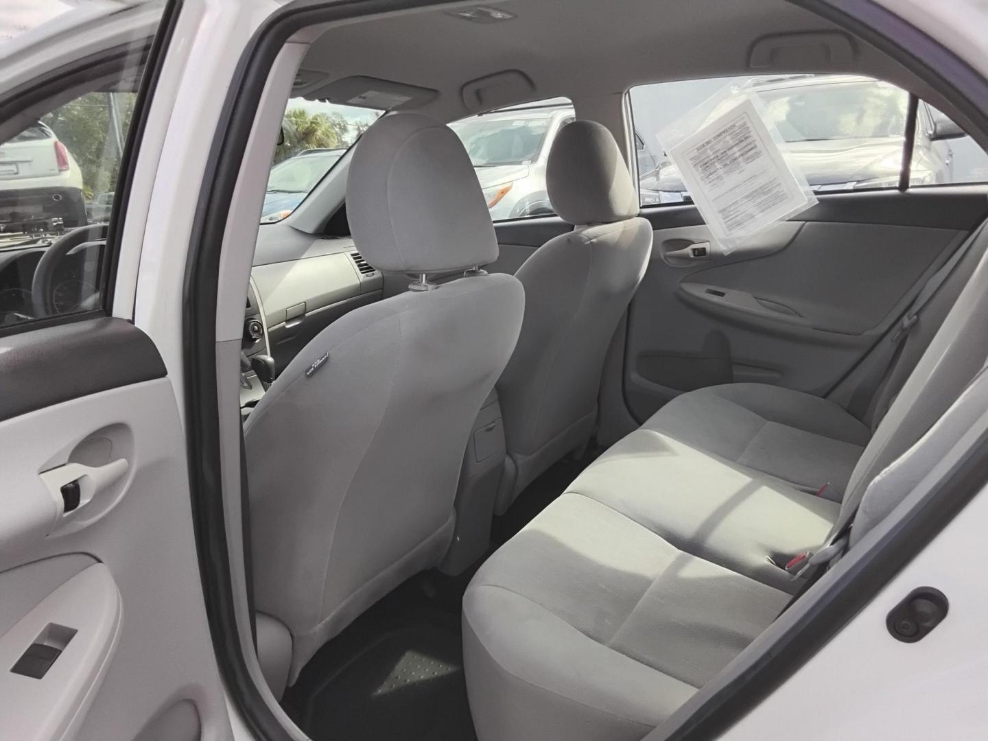 2013 White /Beige Toyota Corolla LE 4-Speed AT (5YFBU4EE0DP) with an 1.8L L4 DOHC 16V engine, 4-Speed Automatic transmission, located at 6112 N Florida Avenue, Tampa, FL, 33604, (888) 521-5131, 27.954929, -82.459534 - $499 DOWN PLUS TAX & TAG. - Photo#8